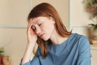 Headaches and RE_BlogPostImage Women having headache