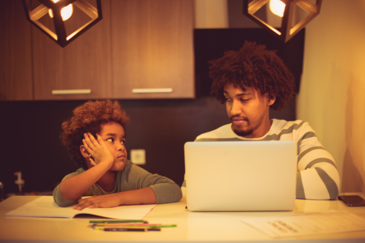 Parent supporting a frustrated child during home-based vision therapy and learning practice