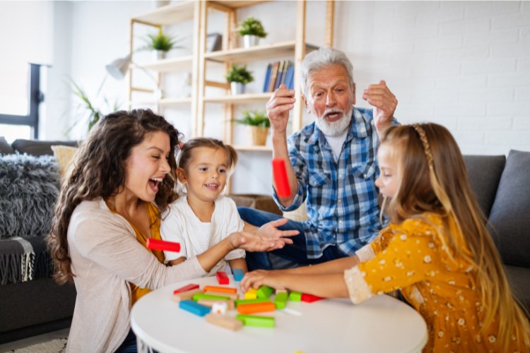 Family playing safely at home with colorful blocks to support children’s visual skills and coordination