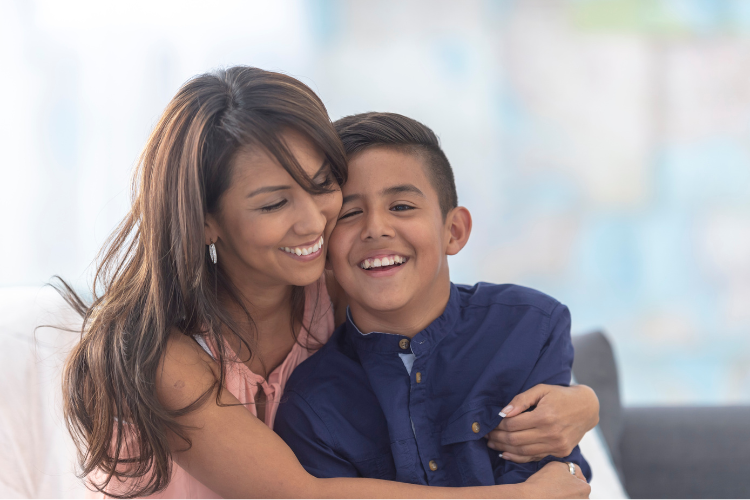 Mother embracing her child while supporting him through amblyopia treatment